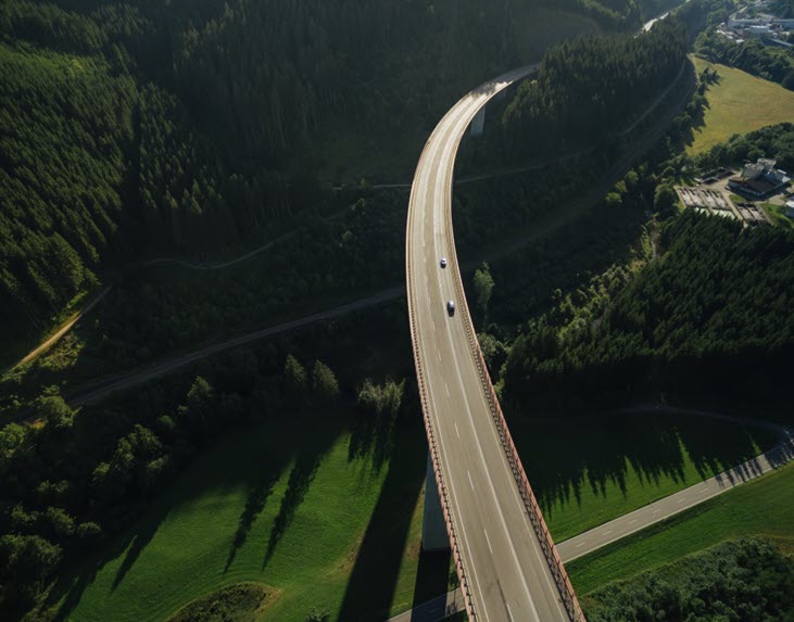 Road going through a green landscape
