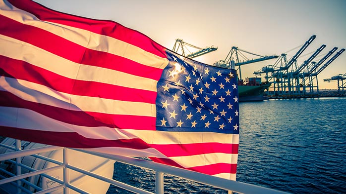 american-flag-on-a-ship-sunset-in-the-background